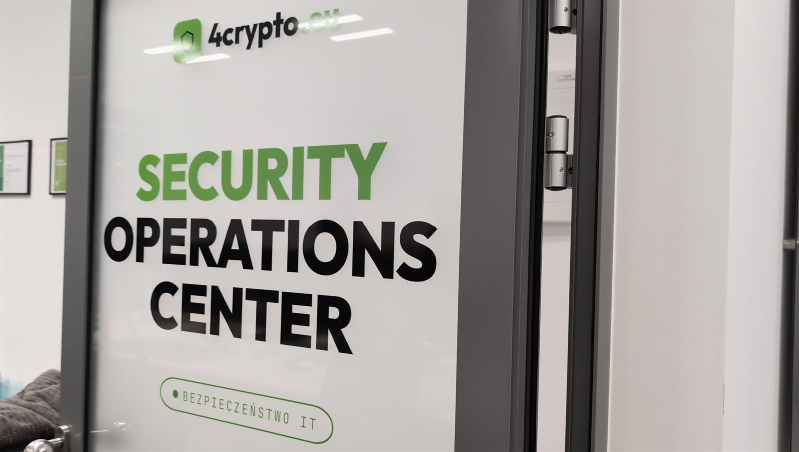 Glass door of the 4crypto Security Operations Center with the SECURITY OPERATIONS CENTER sign and the 4crypto.eu logo